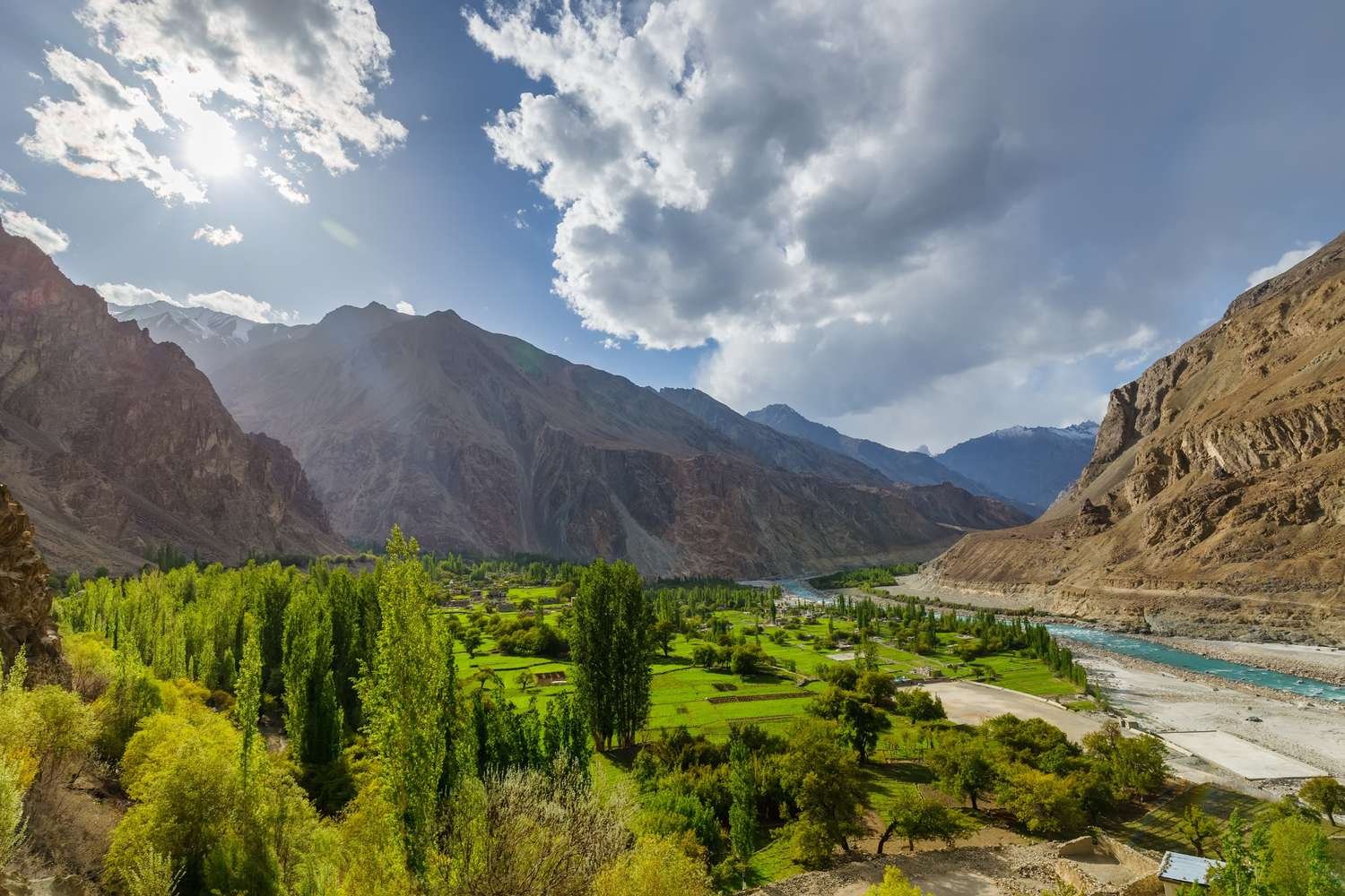 Beautiful landscape of Kashmir valley with houseboats and mountains